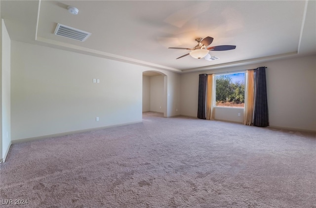 empty room featuring light carpet and ceiling fan