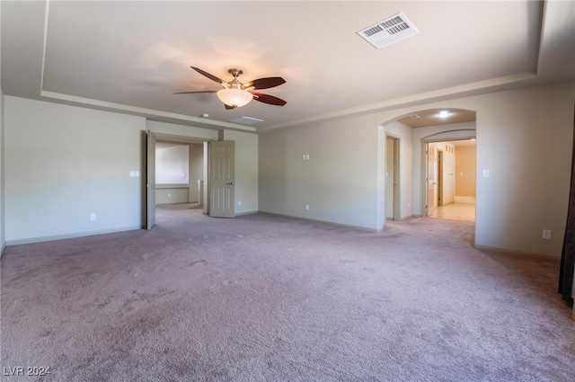 empty room with light carpet and ceiling fan