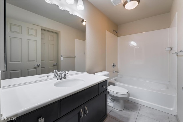 full bathroom featuring vanity, toilet, tile patterned floors, and shower / bathtub combination