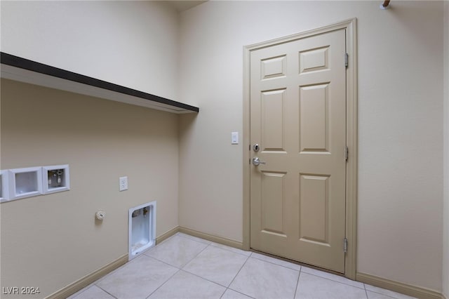 washroom featuring washer hookup, light tile patterned floors, and gas dryer hookup