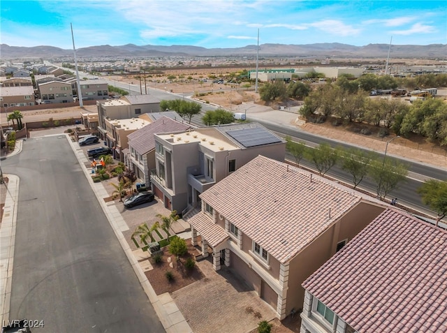 birds eye view of property with a mountain view