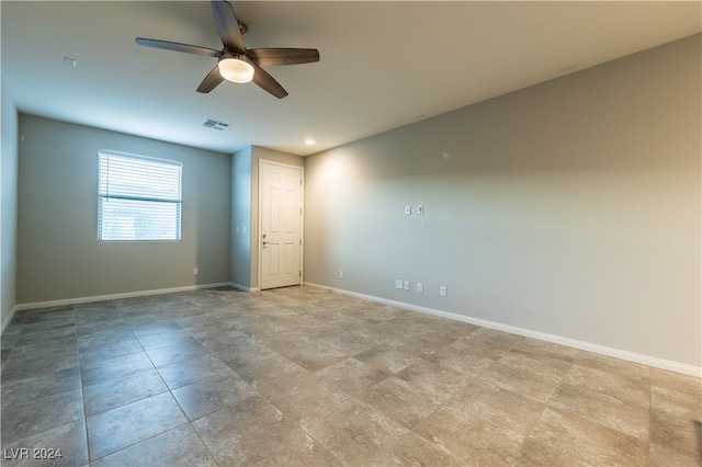 spare room with ceiling fan