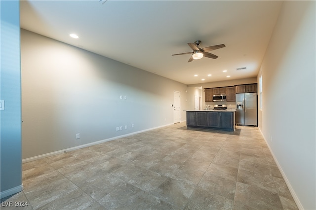 unfurnished living room with ceiling fan