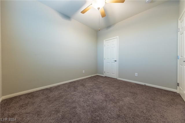 carpeted empty room with lofted ceiling and ceiling fan