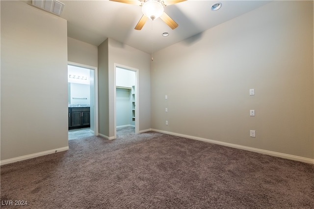 empty room with carpet flooring and ceiling fan