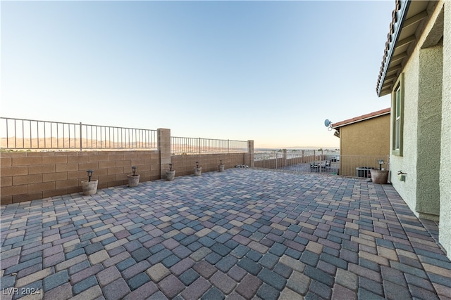 view of patio terrace at dusk