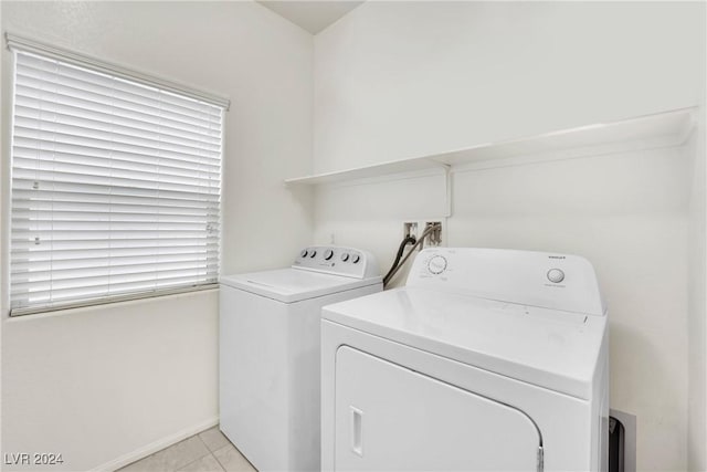 8212 Minots Ledge Ave, Las Vegas, NV 89147 - laundry area with washing machine and dryer, light tile patterned flooring, and baseboards