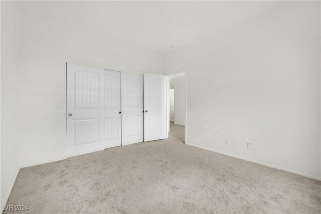 8212 Minots Ledge Ave, Las Vegas, NV 89147 - unfurnished bedroom featuring carpet floors, a closet, and baseboards