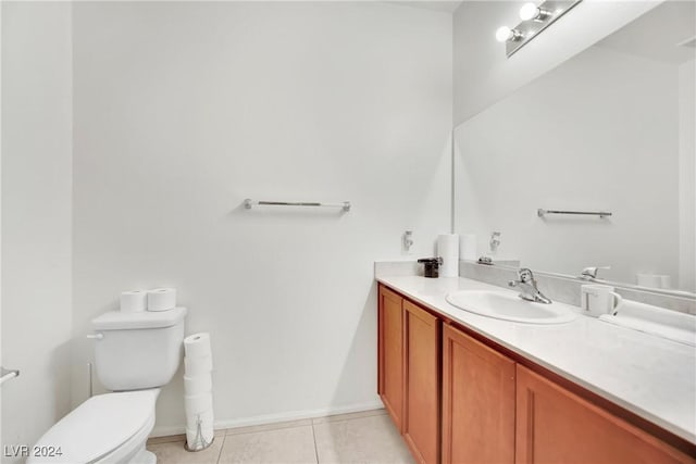 8212 Minots Ledge Ave, Las Vegas, NV 89147 - half bath featuring toilet, vanity, tile patterned flooring, and baseboards