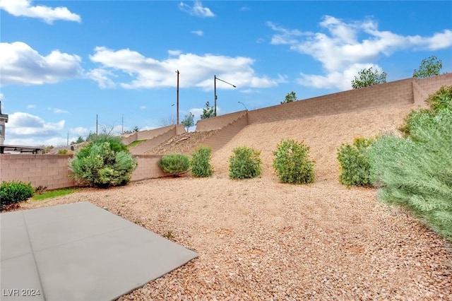 8212 Minots Ledge Ave, Las Vegas, NV 89147 - fenced backyard featuring a patio