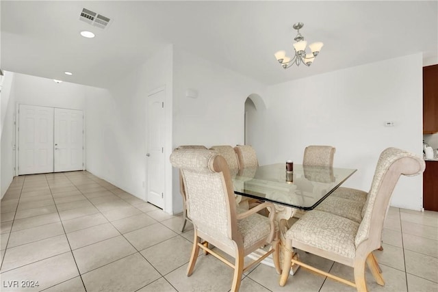 8212 Minots Ledge Ave, Las Vegas, NV 89147 - dining area with light tile patterned floors, a chandelier, arched walkways, and recessed lighting
