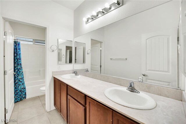 full bathroom with toilet, vanity, tile patterned floors, and shower / tub combo