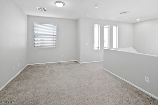 empty room with light colored carpet