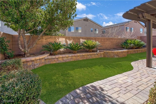 view of yard with a pergola and a patio area