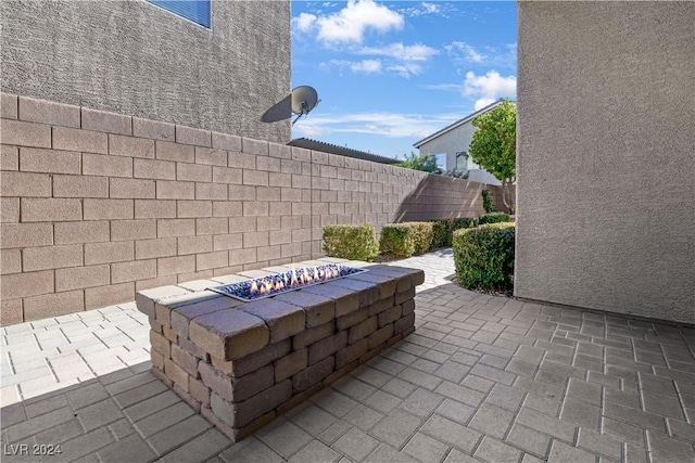 view of patio / terrace featuring a fire pit