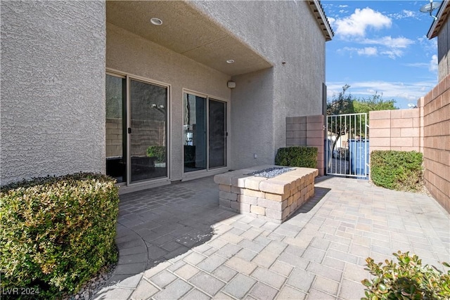 view of patio featuring an outdoor fire pit