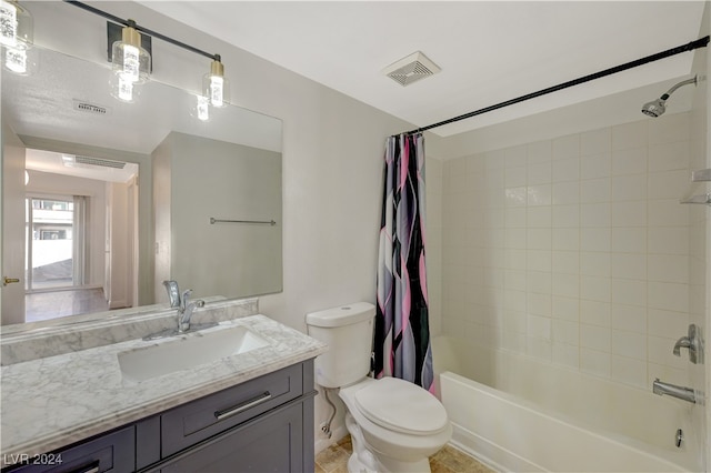 full bathroom featuring vanity, shower / tub combo, and toilet