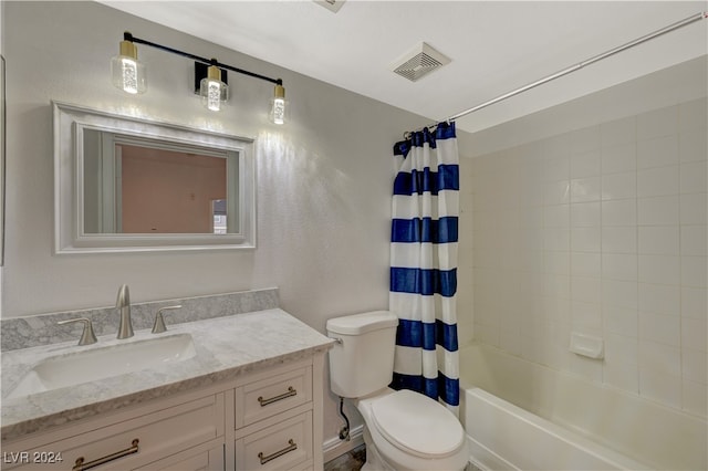 full bathroom featuring vanity, toilet, and shower / bath combo with shower curtain