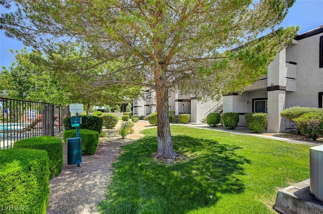 view of property's community with a yard