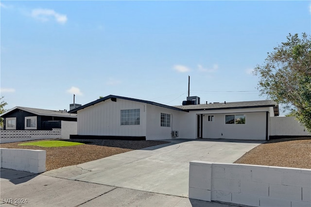 single story home with a patio area and central AC unit