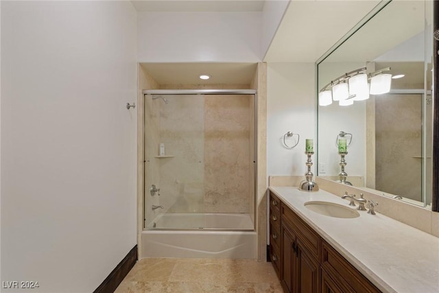 bathroom with vanity and tiled shower / bath combo