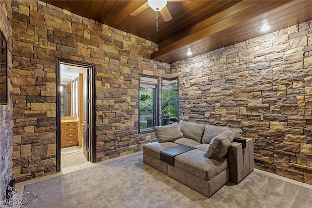 living room featuring ceiling fan, light colored carpet, and wood ceiling