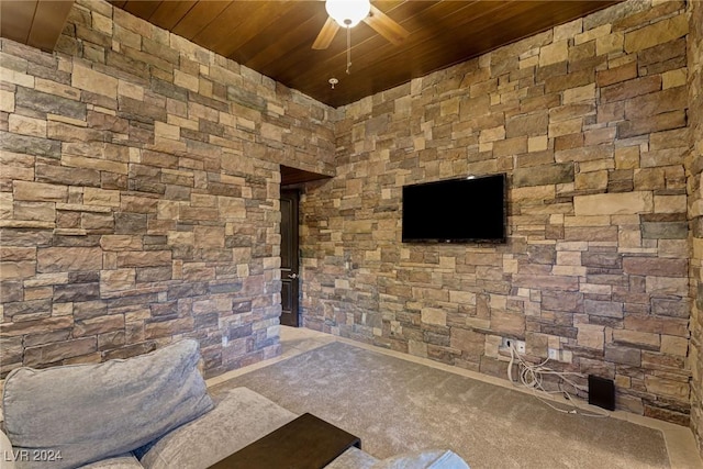 unfurnished living room with carpet flooring and wooden ceiling