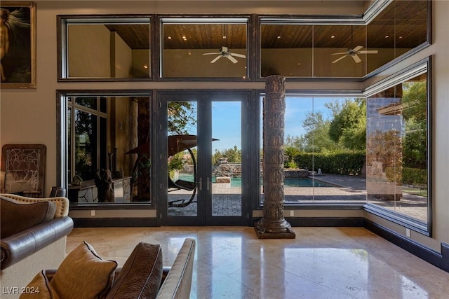 doorway with french doors, a wealth of natural light, and ceiling fan