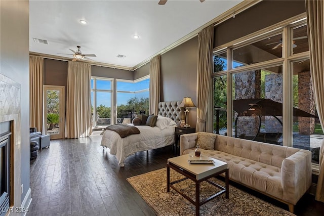 bedroom featuring dark wood-type flooring, access to outside, ceiling fan, and crown molding