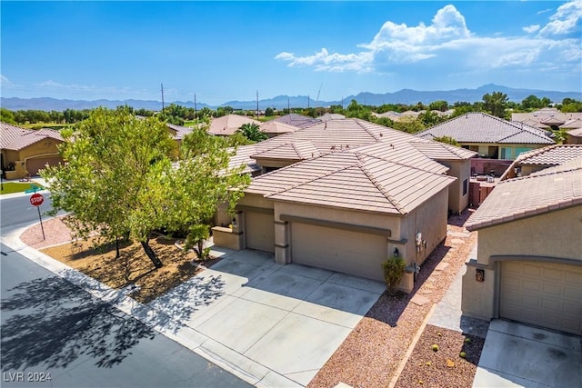 drone / aerial view with a residential view and a mountain view