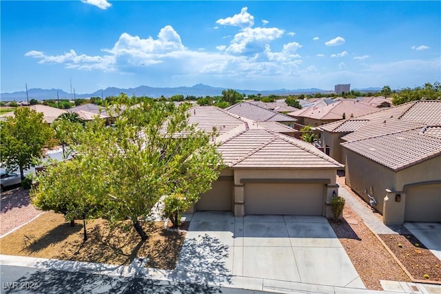 drone / aerial view with a residential view and a mountain view