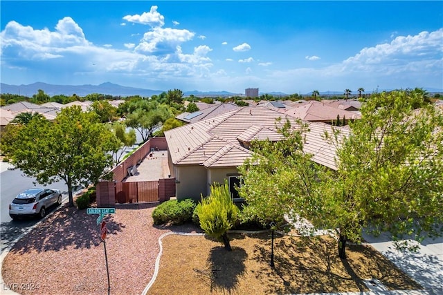 drone / aerial view with a residential view and a mountain view