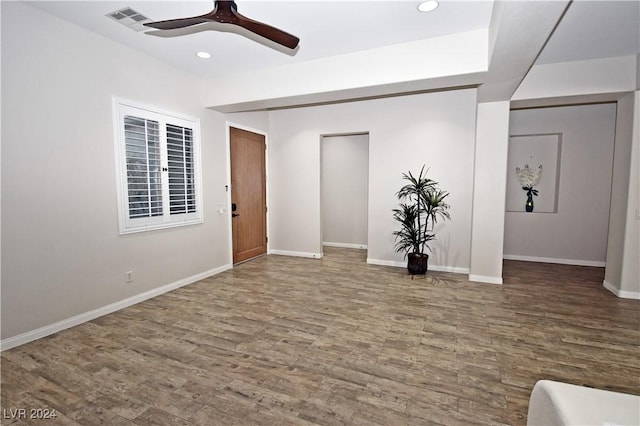 unfurnished living room with recessed lighting, visible vents, ceiling fan, wood finished floors, and baseboards