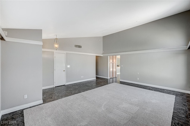 unfurnished room featuring high vaulted ceiling and dark colored carpet