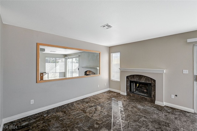 unfurnished living room with a healthy amount of sunlight