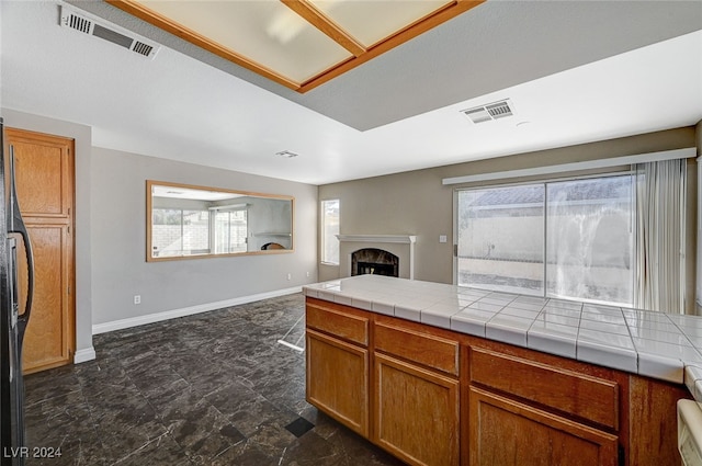 kitchen featuring tile countertops