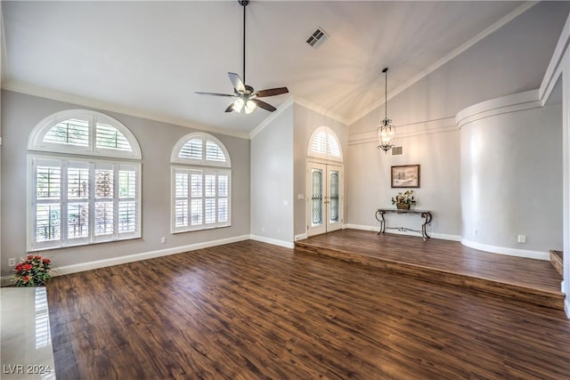 unfurnished living room featuring french doors, dark wood-type flooring, high vaulted ceiling, ceiling fan with notable chandelier, and ornamental molding