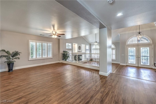 entryway with hardwood / wood-style floors, french doors, a textured ceiling, and plenty of natural light