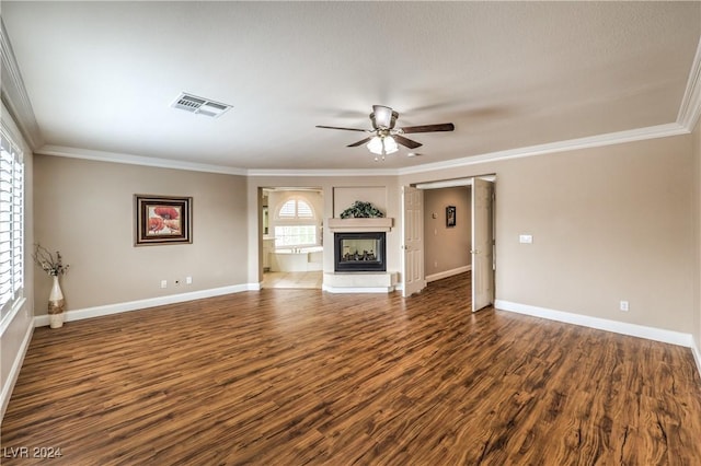 unfurnished living room featuring ceiling fan, dark hardwood / wood-style flooring, and ornamental molding