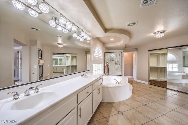 bathroom featuring vanity, tile patterned floors, and independent shower and bath