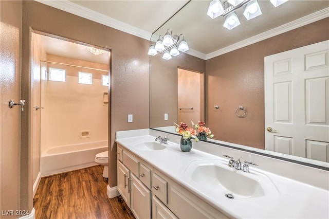 full bathroom with vanity, shower / tub combination, toilet, ornamental molding, and wood-type flooring