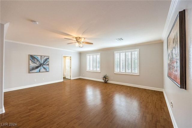 unfurnished room with ceiling fan, dark hardwood / wood-style flooring, and crown molding