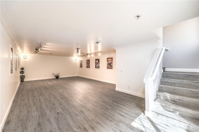 interior space with ornamental molding and dark wood-type flooring