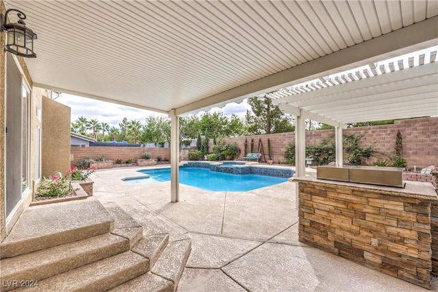 view of pool with a pergola and a patio