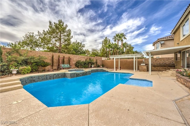 view of swimming pool with an in ground hot tub, a pergola, and a patio area