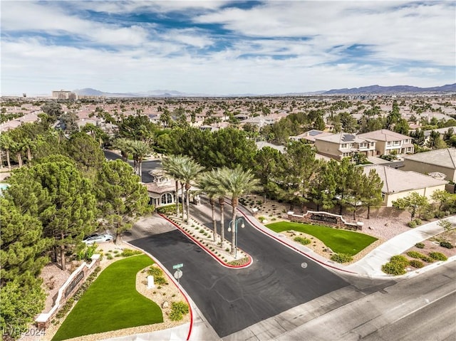 birds eye view of property with a mountain view