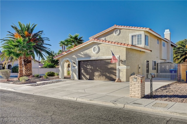 mediterranean / spanish-style home featuring a garage