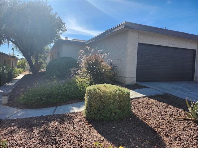 view of property exterior with a garage