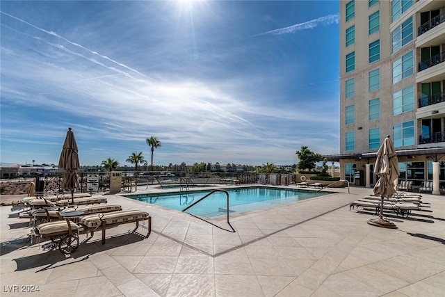 view of swimming pool with a patio area