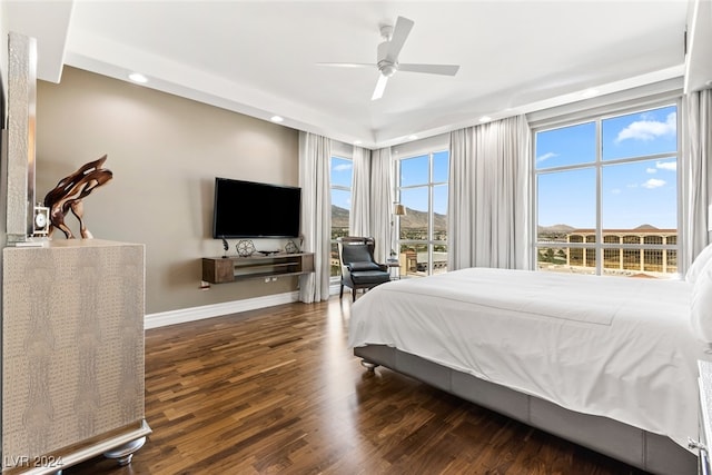 bedroom with dark wood-type flooring and ceiling fan